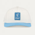 Keep It Suave snapback with cream crown, baby-blue brim, and blue logo patch, front view.