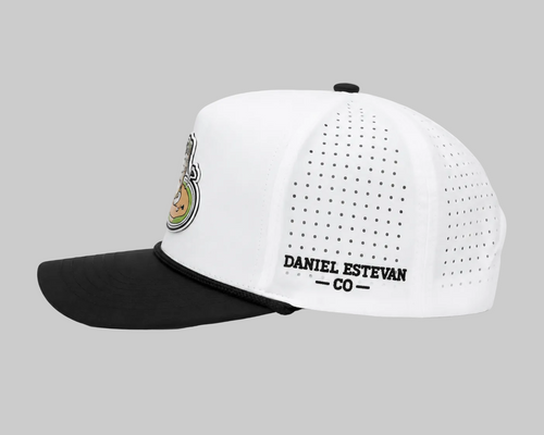 Side view of the white and black Basura Bunker cap with perforated panels and Daniel Estevan Co embroidery.