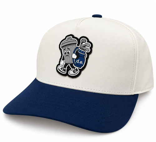 Basura Series Golfer trashcan hat in cream and navy, featuring a trash can character with a blue golf bag