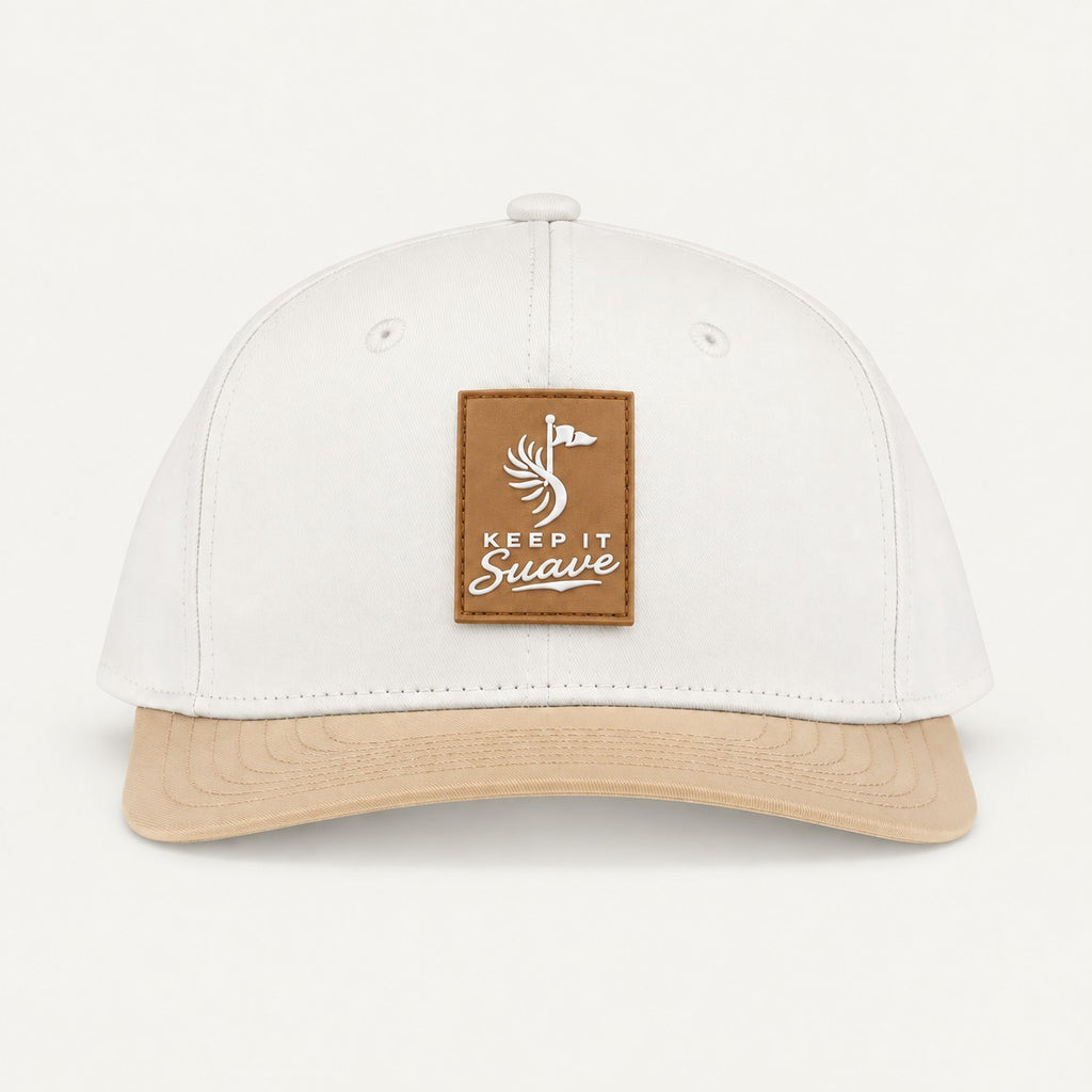 Keep It Suave snapback with cream crown, beige brim, and beige logo patch, front view.